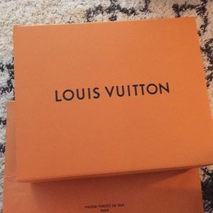 Louis Vuitton box with dusk bag and store bag.